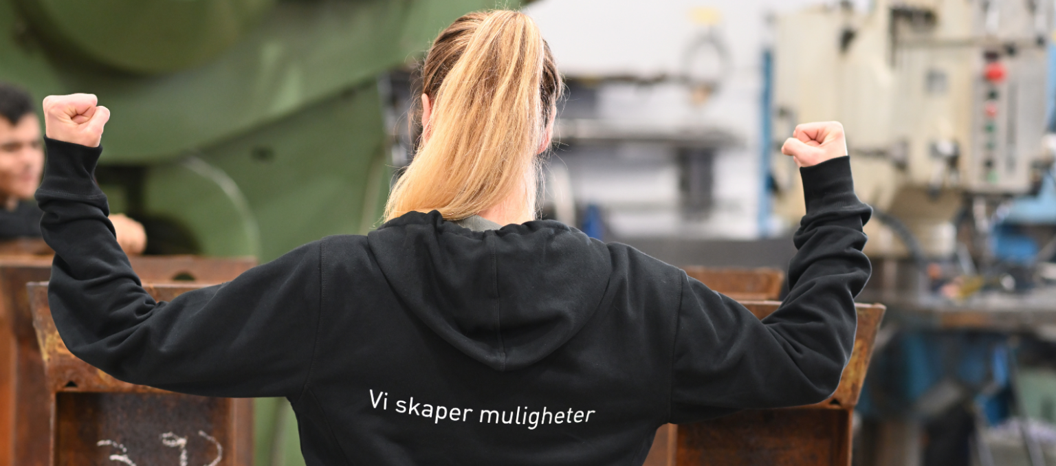 Dame med genser "vi skaper muligheter"